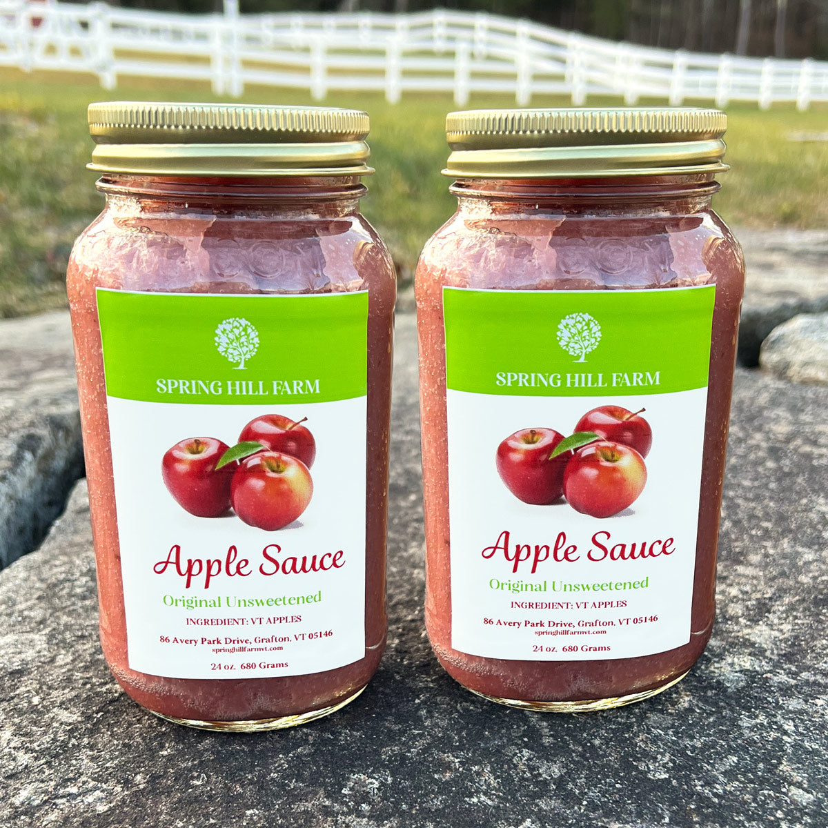 two mason jars of classic unsweetened apple sauce.